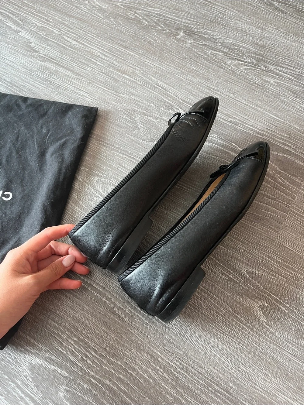 CHANEL Black Leather Cap-Toe Ballet Flats with CC Emblem